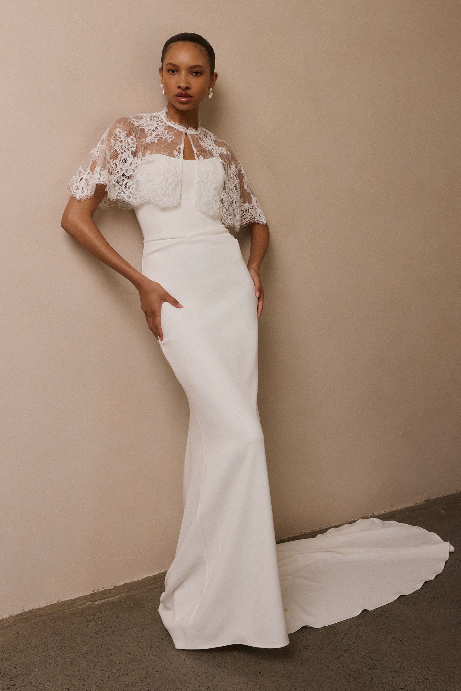 A woman wearing a strapless white mermaid style gown_L_