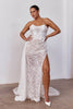Woman wearing a strapless lace wedding dress with a high split_L_