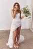 Woman in a strapless lace wedding dress holding a bouquet_XS_
