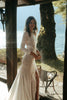 Model wearing the Pierlot gown and Pierlot Veil while holding white bouquet