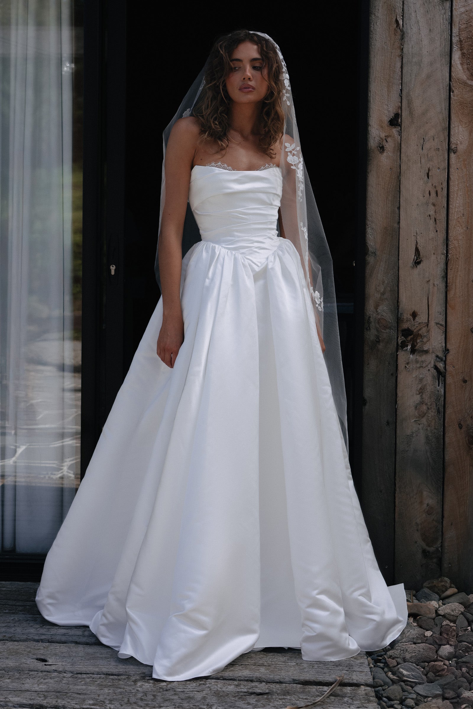 Woman wearing a satin A-line wedding dress_XS_