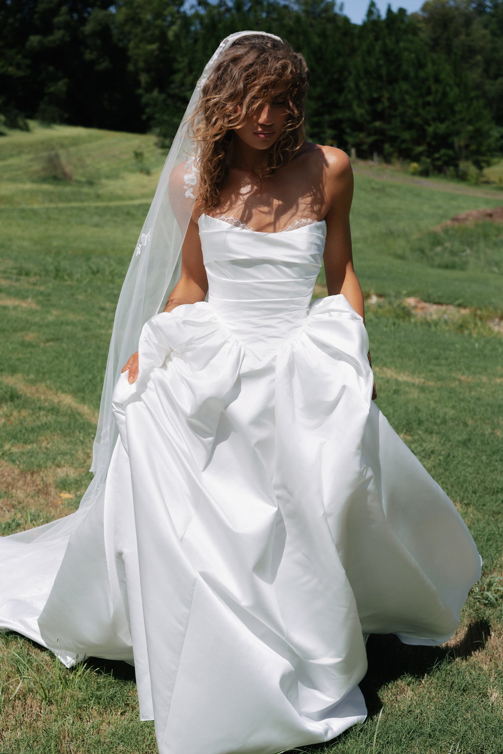 Woman wearing a satin A-line wedding dress_XS_