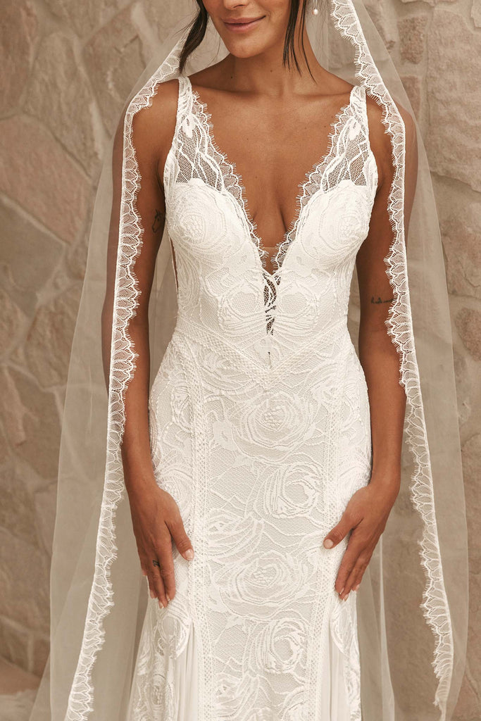 Lace detailing and hourglass sillhouette of the Dahlia wedding gown