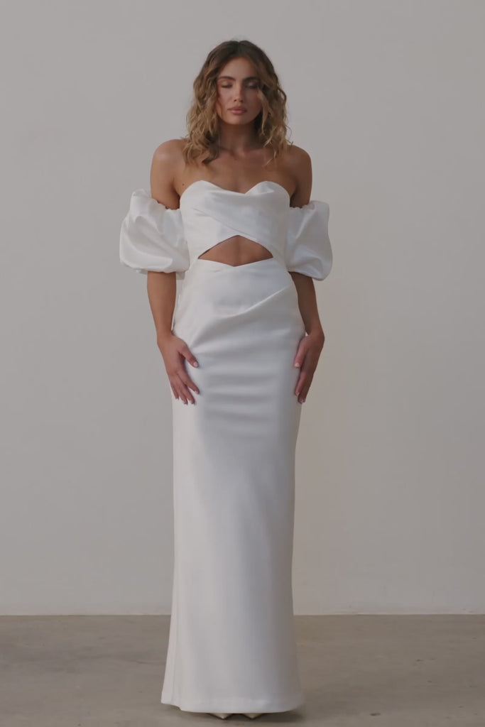 Woman in a satin strapless wedding dress.